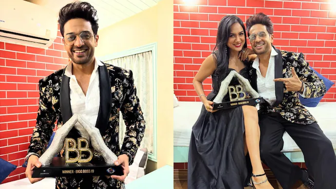 Gaurav Khanna holding the Bigg Boss 19 trophy during the grand finale, smiling emotionally as he celebrates his victory on stage.