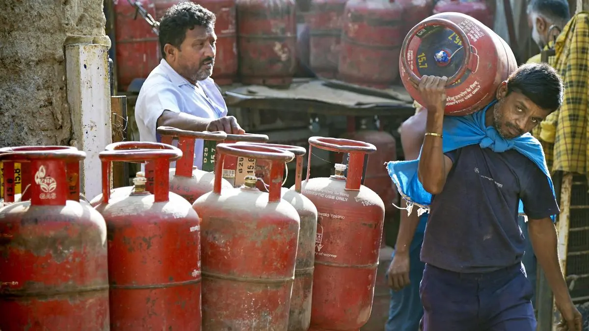 Workers load LPG cylinders at a depot in Nagpur on March 10, 2026.